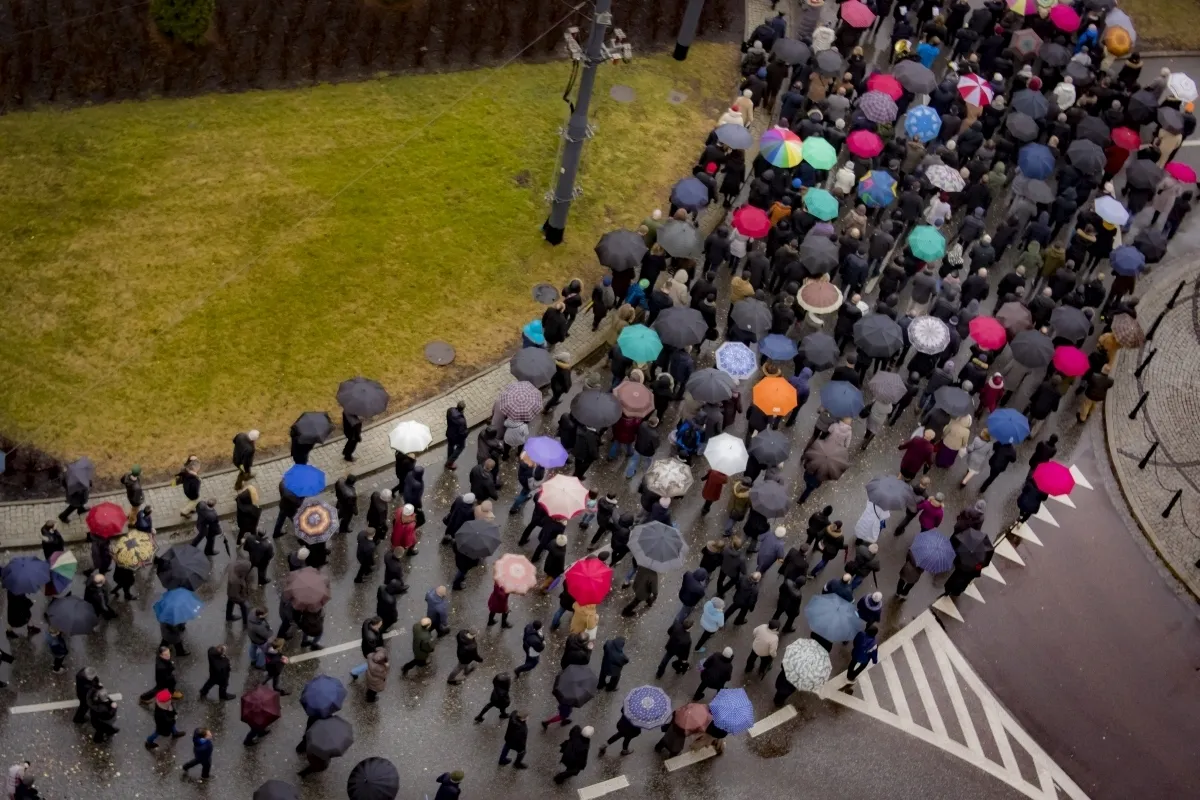 Overhead view of a march filled with umbrellas